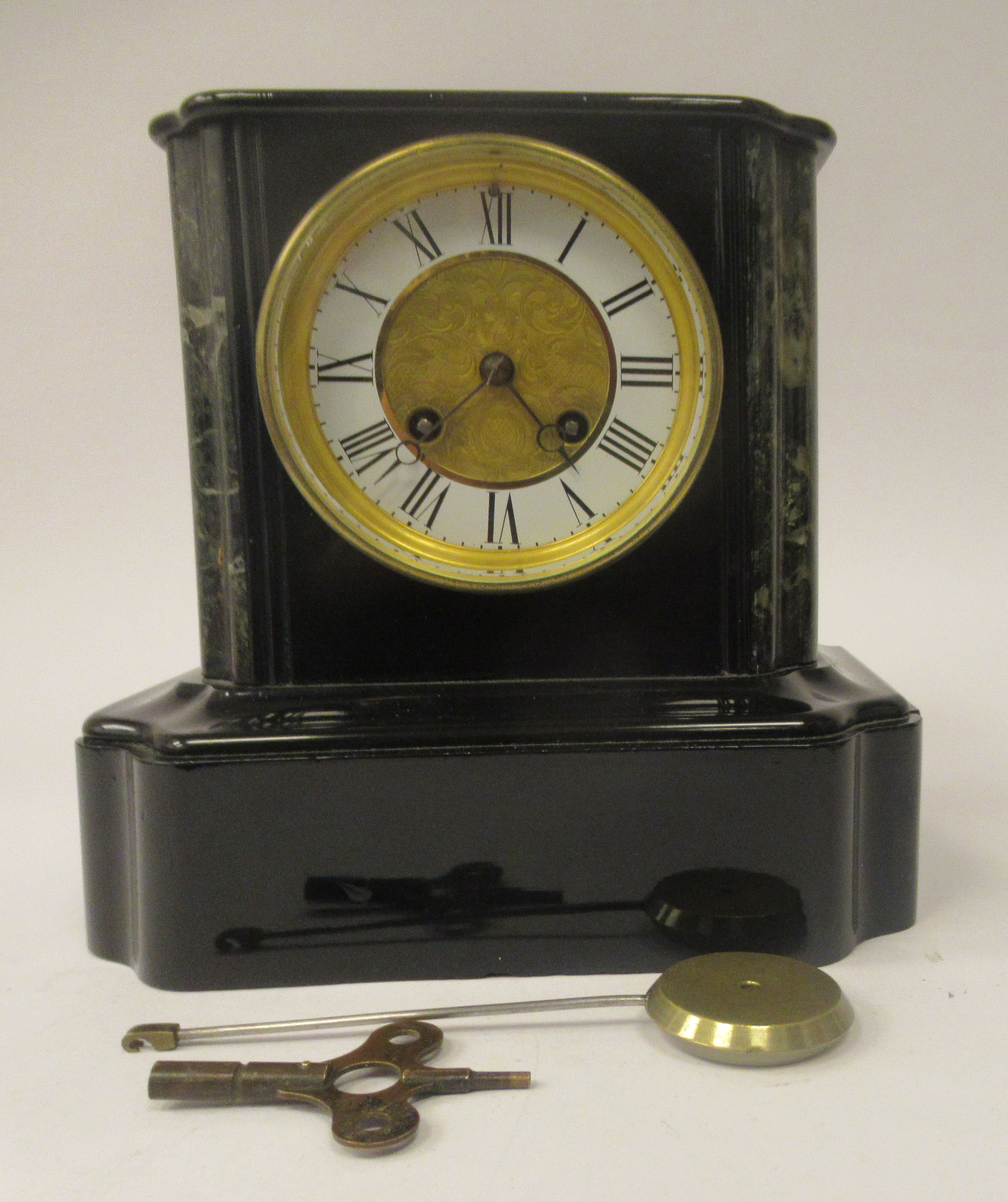 A late 19thC French black slate and mottled green marble cased, platform top mantle clock; the