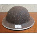 A replica World War II tin hat shell