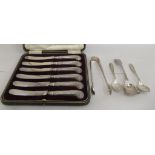 Silver flatware: to include a set of six loaded silver handled butter knives  Birmingham 1892  cased