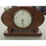 An Edwardian satinwood inlaid mahogany cased mantle clock; the movement faced by an enamel Arabic