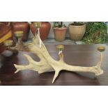 A novelty tea light holder, fashioned from antlers  13"h  22"w
