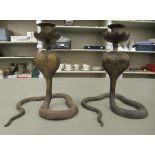 A pair of modern Persian inspired cast brass candlesticks, fashioned as cobra  8"h