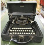 A vintage Corona folding manual portable typewriter with a 10" carriage