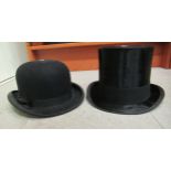 A Henry Heath Limited, Oxford Street, London black silk top hat and a Dunn & Co London black