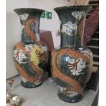 A pair of modern Japanese pottery floorstanding vases, traditionally decorated in bright colours