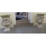 A pair of carved marble terrace pedestal urns with rams' head and female mask ornament  34"h  20"dia