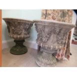 A pair of composition stone pedestal terrace urns with floral ornament  22"h  20"dia