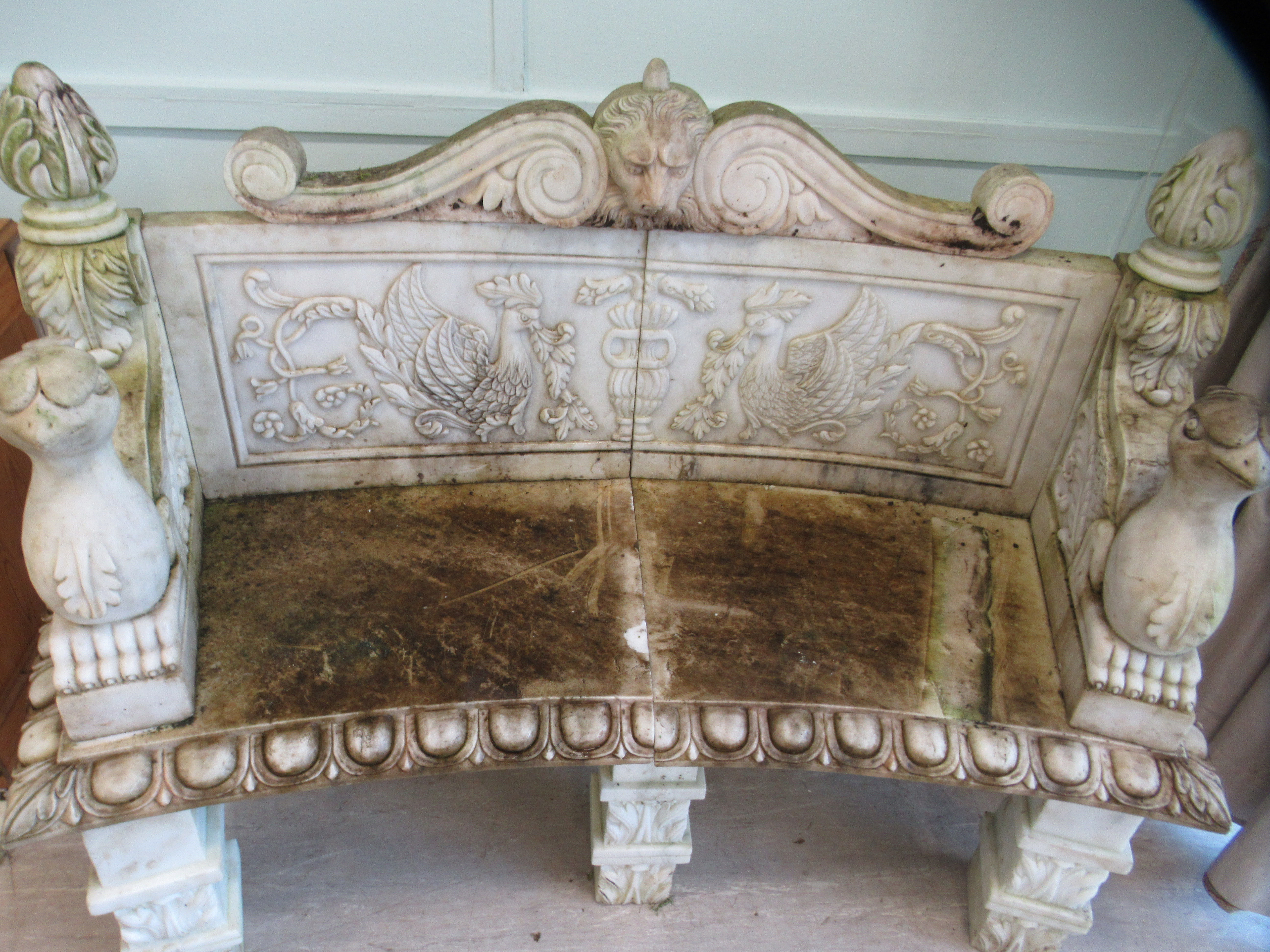 A carved marble terrace seat of in-curved design, featuring mythical birds, a lions' head and - Image 2 of 4