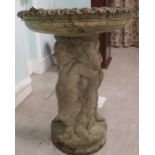 A composition stone bird bath, supported by three cherubic figures  30"h  23"dia