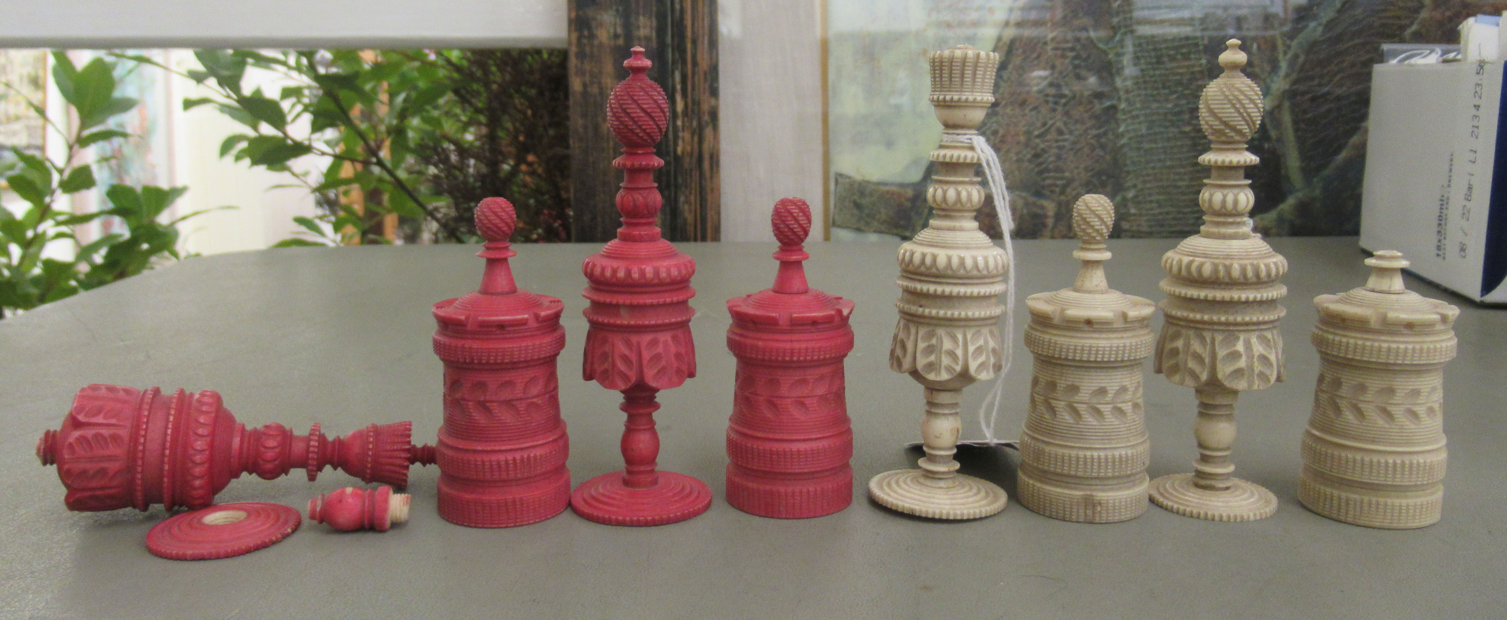 A late 19th/early 20thC carved and turned beetlenut stained and naturally coloured bone chess set - Image 3 of 3