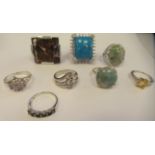 Eight variously gem set dress rings