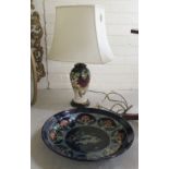 A modern lustre glazed china charger, decorated with a running hare, on a midnight blue ground  17"
