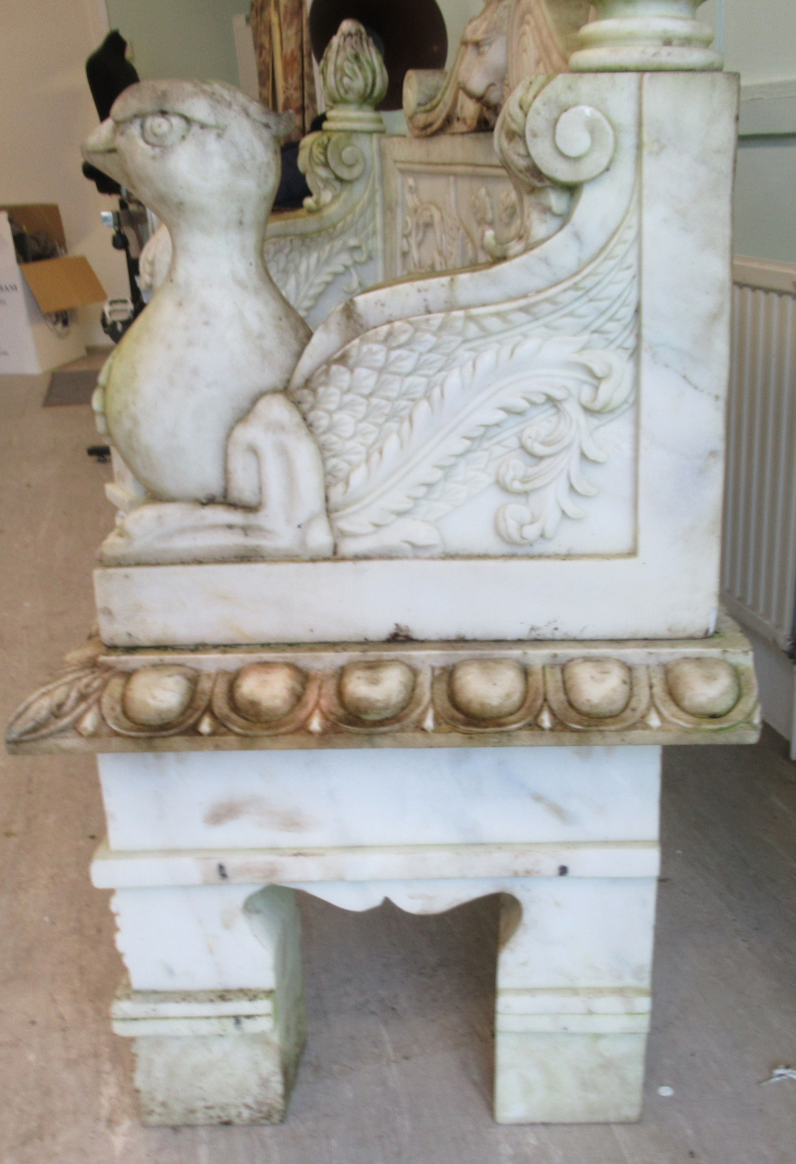 A carved marble terrace seat of in-curved design, featuring mythical birds, a lions' head and - Image 3 of 4