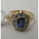 An 18ct gold diamond and sapphire ring  boxed