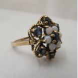 A 9ct gold sapphire and opal cluster ring