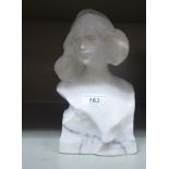 An alabaster carved figure of a young woman  bears an indistinct signature verso  9"h