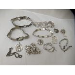Silver coloured metal jewellery: to include bracelets and pendants