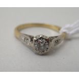 An 18ct bi-coloured gold diamond solitaire ring