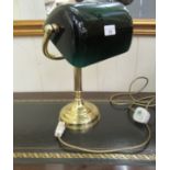 A modern brass desk lamp with a tinted green glass shade  15"h