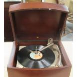 A 1970s Pye Transistor record player, in a mahogany finished tabletop case with a four speed auto