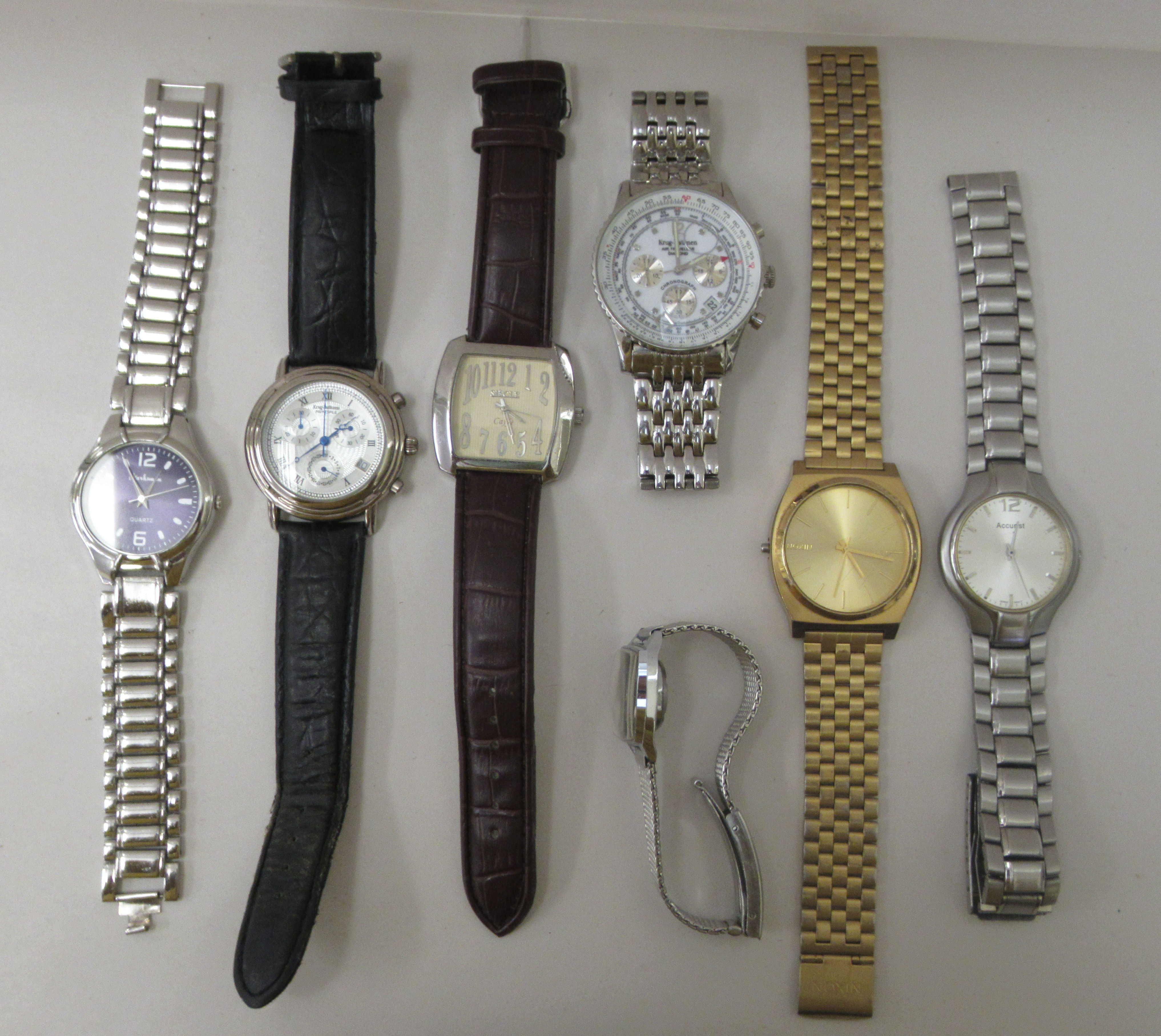 Wristwatches: to include a stainless steel cased accuristic, faced by a baton dial