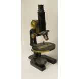 A late 19th/early 20thC Voigtlander No.1410 black enamelled steel and lacquered brass microscope