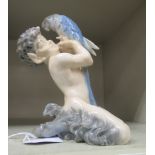 A Royal Copenhagen porcelain model, a mythical creature holding a parrot  model no.452  7"h