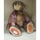 A Limited Edition 37/500 Deans Rag Book Company Teddy bear 'Rufus' with a label under his right