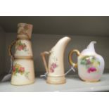 Three dissimilar Royal Worcester china cream jugs, one handpainted with flora, signed J Lander