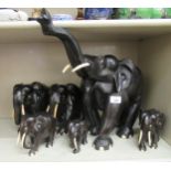 A graduated set of six ebony elephants  4"-15"h