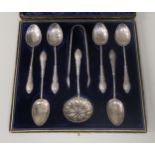 A set of six silver coffee spoons; a pair of tongs and a sugar sifter  mixed marks