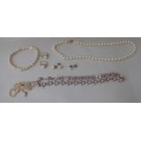 Pearl jewellery: to include mainly necklaces; and a pair of earrings  stamped 585