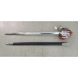 A Scottish Renaissance style broadsword with a red fabric lined and tasselled brass basket hilt, the