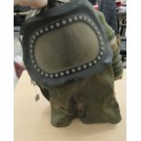 A military issue baby's gas mask with a visor panel  (Please Note:
