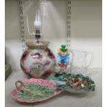 A mixed lot: to include an internally painted glass table lamp  14"h; and a majolica style pottery