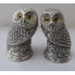 A pair of silver plated novelty condiments pots, fashioned as seated owls