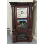 An early/mid 20thC American mahogany finished, partially glazed cased wall clock; the movement faced