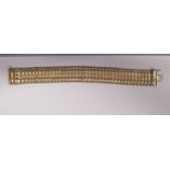 A 9ct gold flexible link bracelet  boxed