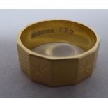 An 18ct gold wedding ring