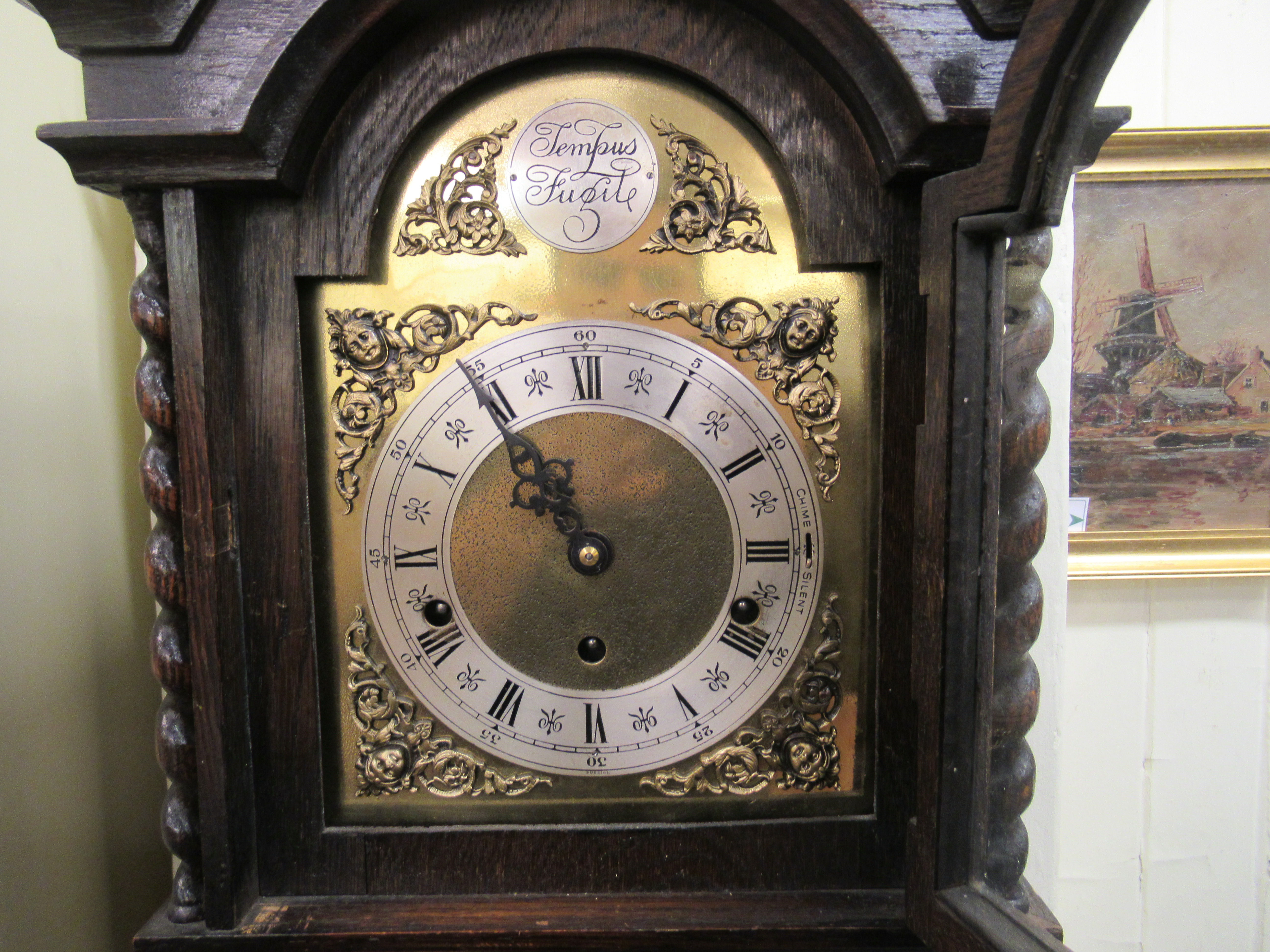 A 1920s/1930s oak cased granddaughter clock, the chiming movement faced by a Tempus Fugit Roman - Image 2 of 5