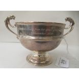 A silver pedestal trophy cup with opposing, scrolled lions' head handles  SW & Co  Birmingham