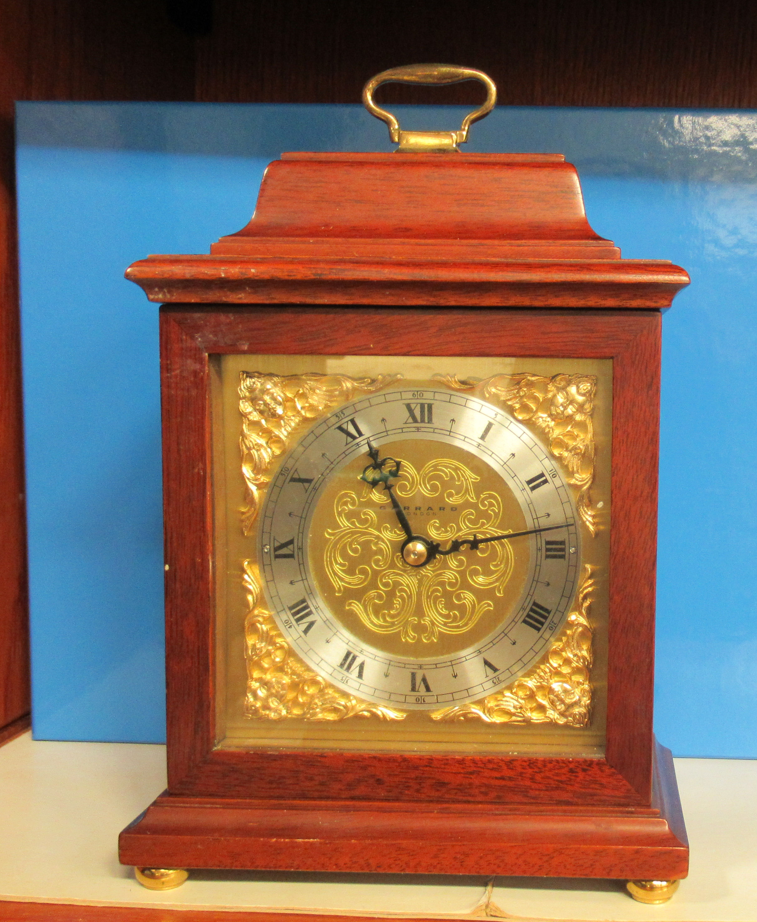 A modern Garrard of London mahogany cased mantle timepiece; the movement faced by a Roman dial  9"