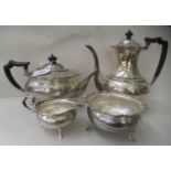 A four piece silver tea set of cauldron design with wavy, applied wire rims, elevated on pad feet