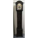 A 1920s/1930s oak cased granddaughter clock, the chiming movement faced by a Tempus Fugit Roman