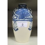 A Royal Doulton china vase of shouldered baluster form, decorated in navy blue with stylised