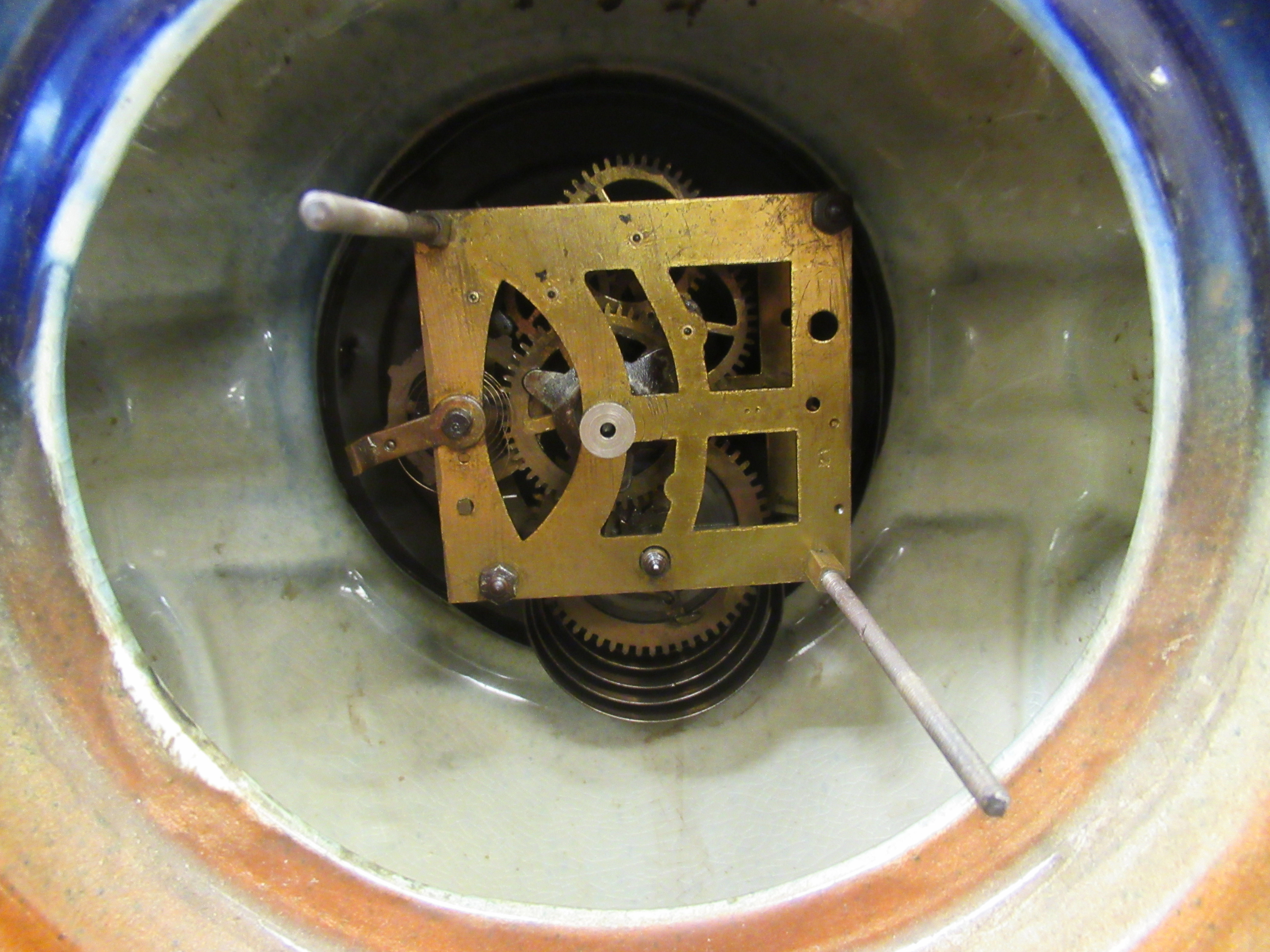 A late Victorian English china cased mantle clock; the movement faced by an Arabic dial, raised on - Image 5 of 8