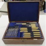 A 1920s Walker & Hall canteen of silver plated cutlery and flatware, in a contemporary fitted oak