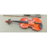 A Chinese Skylark violin with a 15" two piece back  cased with a bow