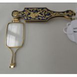 A gilt metal and enamel cased single lens lornette