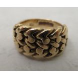 An 18ct gold 'keeper' ring